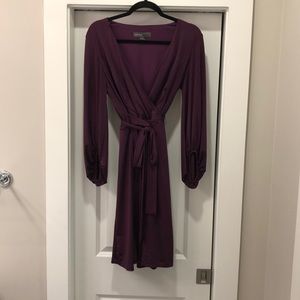 Purple wrap dress with puffy / ruffled sleeves